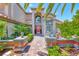 Inviting front entrance featuring desert landscaping, covered patio, and a brick walkway at 364 Clark Dr, Henderson, NV 89074