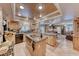 A spacious kitchen boasts an open design with wooden cabinetry, tile floors, and views to the living area at 364 Clark Dr, Henderson, NV 89074