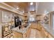 A bright kitchen includes an island cooktop, stone countertops, wooden cabinetry, and recessed lighting at 364 Clark Dr, Henderson, NV 89074