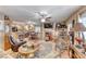 Open-concept living room with fireplace, tile flooring, and seamless kitchen access at 364 Clark Dr, Henderson, NV 89074