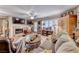 Cozy living room featuring a fireplace, large windows, and comfortable seating at 364 Clark Dr, Henderson, NV 89074