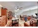 Cozy living space featuring a ceiling fan, multiple desks, and seating for work, perfect for a home office setup at 364 Clark Dr, Henderson, NV 89074