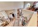 A lofted area with light-toned walls and tile flooring features decorative rugs, trim, and artwork at 364 Clark Dr, Henderson, NV 89074