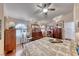 Well lit main bedroom showcasing wood floors, arched windows, and lots of space at 364 Clark Dr, Henderson, NV 89074