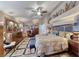Serene main bedroom featuring wood floors, a ceiling fan, and bright natural light at 364 Clark Dr, Henderson, NV 89074