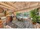 Inviting outdoor patio featuring a grill, dining area, and a tranquil view of the swimming pool and garden at 364 Clark Dr, Henderson, NV 89074