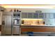 Modern kitchen with stainless steel appliances, wood cabinets and backsplash lighting at 3722 S Las Vegas Blvd # 1111, Las Vegas, NV 89113
