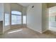 Spacious carpeted bedroom, filled with natural light and a view of the bathroom at 3766 Port Ritchey St, Las Vegas, NV 89147