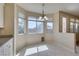 Cozy dining area with large windows and chandelier at 3766 Port Ritchey St, Las Vegas, NV 89147