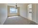 Sunlit dining room with a stylish chandelier, neutral carpet, and interior view at 3766 Port Ritchey St, Las Vegas, NV 89147