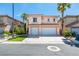 Beautiful two-story home featuring a spacious three-car garage and palm trees at 3766 Port Ritchey St, Las Vegas, NV 89147