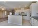 Modern kitchen with white cabinets, granite countertops, and stainless steel appliances at 3766 Port Ritchey St, Las Vegas, NV 89147