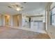 Open kitchen design with white cabinets, tile floors and views of the living space at 3766 Port Ritchey St, Las Vegas, NV 89147