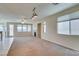 Bright, open living room featuring a cozy fireplace and large windows for lots of natural light at 3766 Port Ritchey St, Las Vegas, NV 89147
