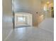 Bright living room featuring soaring ceilings, tile flooring, and a staircase at 3766 Port Ritchey St, Las Vegas, NV 89147