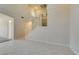 Bright living room featuring soaring ceilings, tile flooring, and a staircase at 3766 Port Ritchey St, Las Vegas, NV 89147