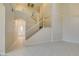 Bright living room featuring soaring ceilings, tile flooring, and a staircase at 3766 Port Ritchey St, Las Vegas, NV 89147