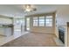 Sun-filled living room with fireplace, adjacent to a kitchen and dining area at 3766 Port Ritchey St, Las Vegas, NV 89147
