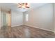 Open bedroom with a ceiling fan and tile flooring creates a cool, inviting, and spacious atmosphere at 421 Point Sur Ave, Las Vegas, NV 89138