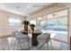 Virtually staged dining area with backyard view, featuring a stylish table setting and contemporary decor at 421 Point Sur Ave, Las Vegas, NV 89138