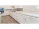 Well-appointed kitchen featuring sleek white cabinetry, ample counter space, and stainless steel appliances at 421 Point Sur Ave, Las Vegas, NV 89138