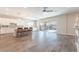 Bright, open-concept living area with wood floors, kitchen island, and access to the backyard at 421 Point Sur Ave, Las Vegas, NV 89138