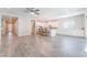 Open concept living room featuring an island kitchen, and wood-look tile flooring at 421 Point Sur Ave, Las Vegas, NV 89138