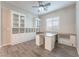 Bright home office with custom shelving and cabinetry, offering ample space for productivity and organization at 421 Point Sur Ave, Las Vegas, NV 89138