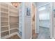 Spacious pantry with custom shelving and pull-out wire baskets, perfect for organized storage at 421 Point Sur Ave, Las Vegas, NV 89138