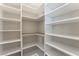 Extensive walk-in pantry with custom shelving providing ample storage at 421 Point Sur Ave, Las Vegas, NV 89138