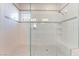 Modern walk-in shower with tiled walls, bench seating, and a glass enclosure at 421 Point Sur Ave, Las Vegas, NV 89138