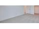 Modern bedroom with carpeting, walk in closet, and neutral color scheme at 4349 Tabor Peak Ave, Las Vegas, NV 89141