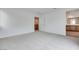 A spacious carpeted bedroom with neutral tones and an open doorway to a walk in closet at 4349 Tabor Peak Ave, Las Vegas, NV 89141