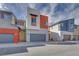 Charming two-story home with modern design, grey garage door, and red accent wall at 4349 Tabor Peak Ave, Las Vegas, NV 89141