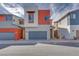 Charming two-story home with modern design, grey garage door, and red accent wall at 4349 Tabor Peak Ave, Las Vegas, NV 89141