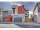 Charming two-story home with modern design, grey garage door, and red accent wall at 4349 Tabor Peak Ave, Las Vegas, NV 89141