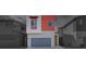 Charming two-story home with modern design, grey garage door, and red accent wall at 4349 Tabor Peak Ave, Las Vegas, NV 89141