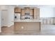 Bright kitchen boasts an island with modern sink and countertop at 4349 Tabor Peak Ave, Las Vegas, NV 89141