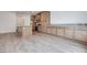 Modern kitchen featuring an island with grey countertops and natural wood cabinets at 4349 Tabor Peak Ave, Las Vegas, NV 89141