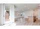 Bright, open-concept living area with hardwood floors and a modern kitchen island with bar seating at 4349 Tabor Peak Ave, Las Vegas, NV 89141