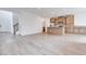 Spacious living room and kitchen area with modern flooring and natural wood cabinets at 4349 Tabor Peak Ave, Las Vegas, NV 89141