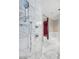 Close up of a modern shower space featuring a rainfall head, handheld sprayer, and marble walls at 4381 W Flamingo Rd # 3710, Las Vegas, NV 89103