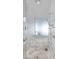 Modern walk-in shower clad in marble, featuring a rainfall shower head and handheld sprayer at 4381 W Flamingo Rd # 3710, Las Vegas, NV 89103