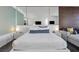 A bright suite showcasing a Queen bed, side tables, and mirrored walls at 4381 W Flamingo Rd # 3710, Las Vegas, NV 89103