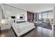 Well-lit open floor plan main suite featuring hardwood floors, city views, and modern furnishings at 4381 W Flamingo Rd # 3710, Las Vegas, NV 89103