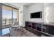 Living room showcasing city views, modern decor, and a large sliding glass door to the balcony at 4381 W Flamingo Rd # 3710, Las Vegas, NV 89103