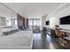 A spacious main suite and living area featuring hardwood floors, city views, and modern furnishings at 4381 W Flamingo Rd # 3710, Las Vegas, NV 89103