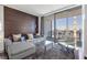 Comfortable living room features a couch, city views, and access to the balcony at 4381 W Flamingo Rd # 3710, Las Vegas, NV 89103