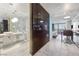 A modern open-concept condo featuring an island, kitchen, bath, and living space all brightly lit at 4381 W Flamingo Rd # 3710, Las Vegas, NV 89103