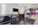 A main suite with modern desk and office area featuring dark hardwood floors and an open floor plan at 4381 W Flamingo Rd # 3710, Las Vegas, NV 89103